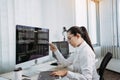 Software developers are analyzing about the code written into the program on the computer in office room Royalty Free Stock Photo