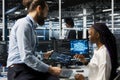 Software developers coding in data center, updating AI automation scripts Royalty Free Stock Photo
