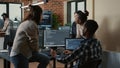 Software developers discussing about programming while the rest of the team joins the discussion Royalty Free Stock Photo