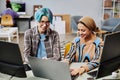 Software developers using computers in office
