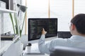 Software development concept, Male programmer checking data codes on document and computer screen