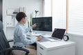 Software development concept, Male programmer checking data codes on document and computer screen