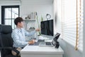 Software development concept, Male programmer checking data codes on document and computer screen