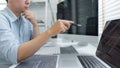 Software development concept, Male programmer pointing on laptop screen to checking data codes Royalty Free Stock Photo