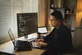Software develper asian man wearing glasses working coding Write a program develope AI application on laptop at home office. Royalty Free Stock Photo