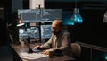 Software engineer typing source code on multiple monitors Royalty Free Stock Photo