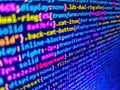 Software engineer at work. Minificated web development javascript code close up in sunset rays. Software abstract background. Royalty Free Stock Photo