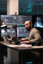 Software engineer writing code on multiple screens Royalty Free Stock Photo