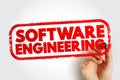 SOFTWARE ENGINEERING text stamp, hand holding pen symbolizing coding, development, programming, and digital technology professions Royalty Free Stock Photo