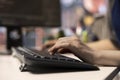 Software expert at workstation programming on pc and writing lines of code Royalty Free Stock Photo
