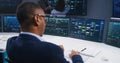 Team of IT technical specialists work in monitoring office Royalty Free Stock Photo