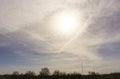 Softy and white fluffy cloudy blue sky with sunlight above the land of trees Royalty Free Stock Photo