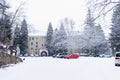 SOFÃÂA, BULGARIA - 13 DECEMBER 2017: View of the car park in front of the entrance to the snowy Rila Monastery.