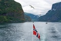 Sognefjord and Neroyfjord mountain sea view with Norwegian flag, Norway Royalty Free Stock Photo