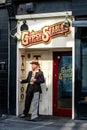 Man Standing In Doorway Of Gypsy Stables Tattoo Studio Royalty Free Stock Photo