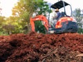 Soil close up blurred backhoe to renovate the site in preparation for pouring the concrete slab