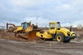 Soil Compactor and bulldozer at construction site Royalty Free Stock Photo