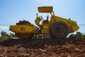 The soil compactor is in the work area.Road roller equipped with padfoot drum