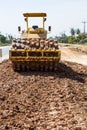 The soil compactor is in the work area.Road roller equipped with padfoot drum Royalty Free Stock Photo