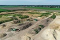 Soil heaps and material for soil recycling at the edge of a sand pit in Germany, taken from the air with the drone flight