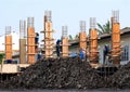 Clay wet black and Construction Site, Construction workers, People labor are working on construction building Royalty Free Stock Photo