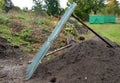 Soil preparation in the garden. compost needs to be emptied from time to time and twigs and stones sorted out. the soil is thrown Royalty Free Stock Photo