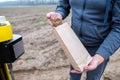 Soil Sampling. An engineer employee of a research laboratory packs a soil sample in a paper package. Automated probe for soil