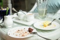 Soiled cake plates on rattan table. Royalty Free Stock Photo