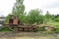 Sokolniki, Kuvshinovsky district, Tver region, Russia. Skidder. An old broken skidder stands on the side of the road .