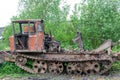 Sokolniki, Kuvshinovsky district, Tver region, Russia. Skidder. An old broken skidder stands on the side of the road .