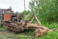 Sokolniki, Kuvshinovsky district, Tver region, Russia. Skidder. An old broken skidder stands on the side of the road .