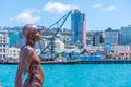 Solace in the Wind (The Naked Man) statue in Port of Wellington, New Zealand