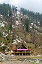 Solang, Himachal Pradesh, India-April 16th, 2015: Colorful entrance building of ski club and rope-way starting location with snow Royalty Free Stock Photo