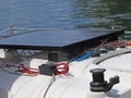 Solar battery for the development of electric current under the influence of sunlight mounted on the deck of a small sailing yacht