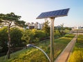 Solar battery and lantern in park close-up side view. Royalty Free Stock Photo