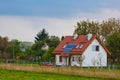 Solar battery on the roof of a rural house under a blue sunny sky. solar energy, alternative electricity Royalty Free Stock Photo