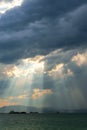 Solar beams breaking through clouds Royalty Free Stock Photo