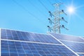 Solar cells in power station alternative energy from the sun with high voltage electric pylon pillars Royalty Free Stock Photo