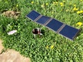 Solar charge and tea cup on the grass