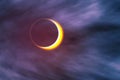 Solar eclipse with clouds. Full solar eclipse, astronomical phenomenon - full sun eclipse. The Moon covering the Sun in a partial Royalty Free Stock Photo