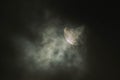 Solar eclipse on a cloudy day. Royalty Free Stock Photo