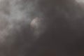 Solar eclipse on a cloudy day. Royalty Free Stock Photo