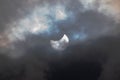 Solar eclipse on a cloudy day. Royalty Free Stock Photo
