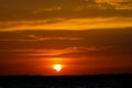 Solar eclipse at sunset across the sky above the sea Royalty Free Stock Photo