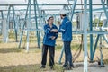 Solar electric installer and practitioner inspect electrical systems for appropriate wiring, polarity, grounding, and termination Royalty Free Stock Photo