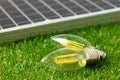 Solar energy panel and light bulb, green energy Royalty Free Stock Photo