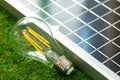 Solar energy panel and light bulb, green energy Royalty Free Stock Photo