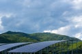 Solar energy panels and green mountain