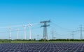 Solar energy panels, wind power and electricity pylons Royalty Free Stock Photo