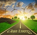 Solar energy panels and wind turbines at sunset. Royalty Free Stock Photo